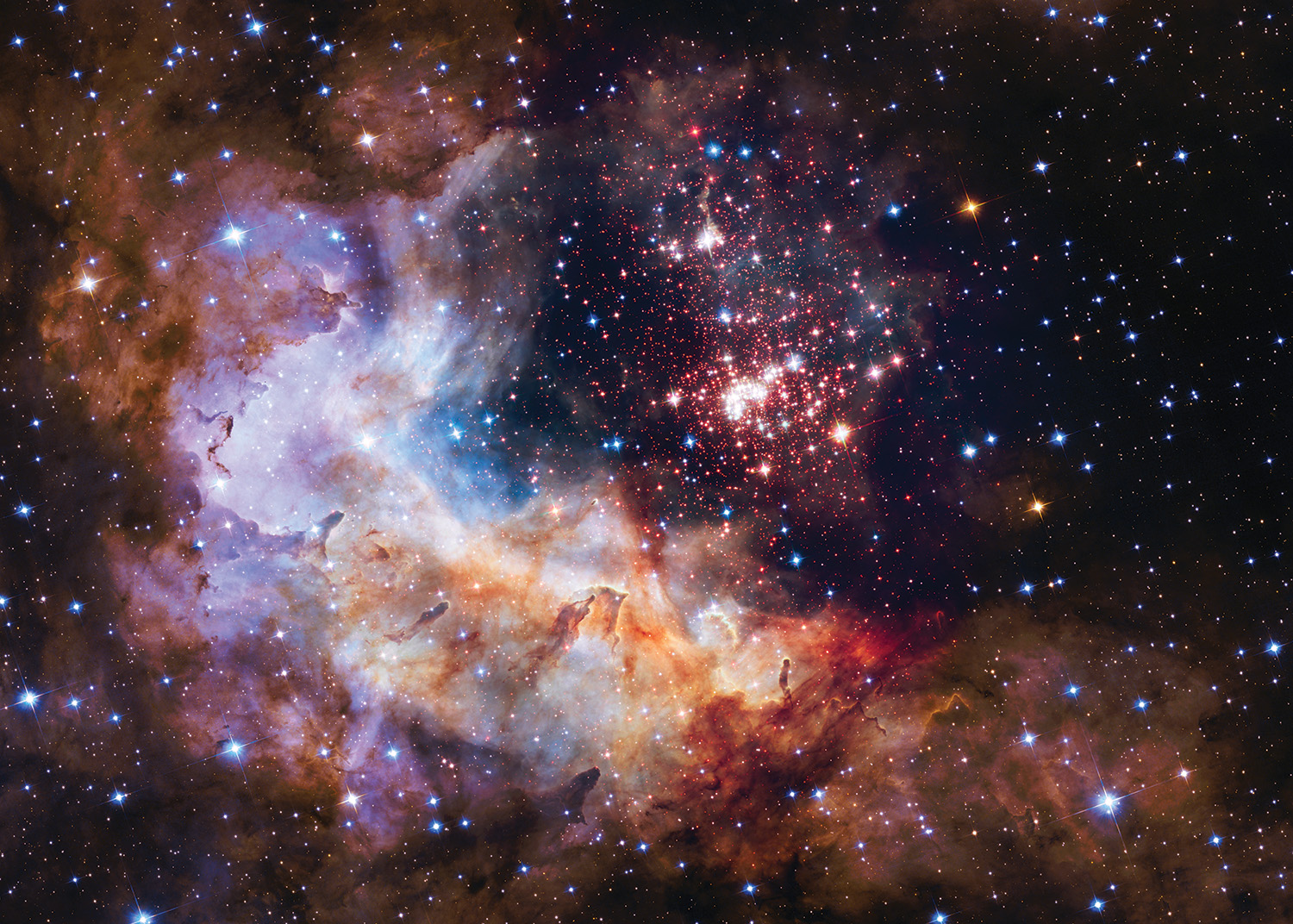 A cluster of small stars sits near the middle of the image. The stars are red, white, blue, and glowing. They are surrounded by a cloud of purple, red, orange, and white vapors, also glowing. Large and tiny stars with points fill the black background.