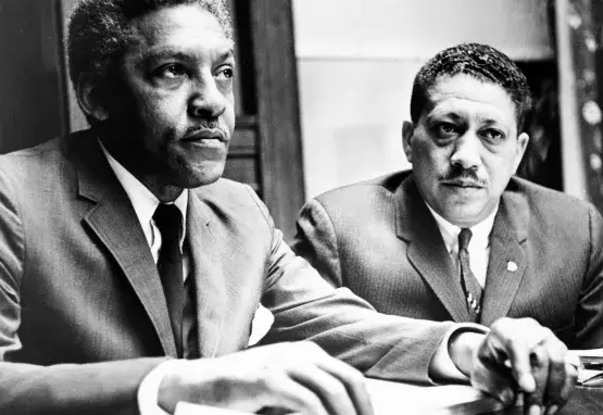 Civil rights activists Bayard Rustin and Eugene Reed speak at Freedom House