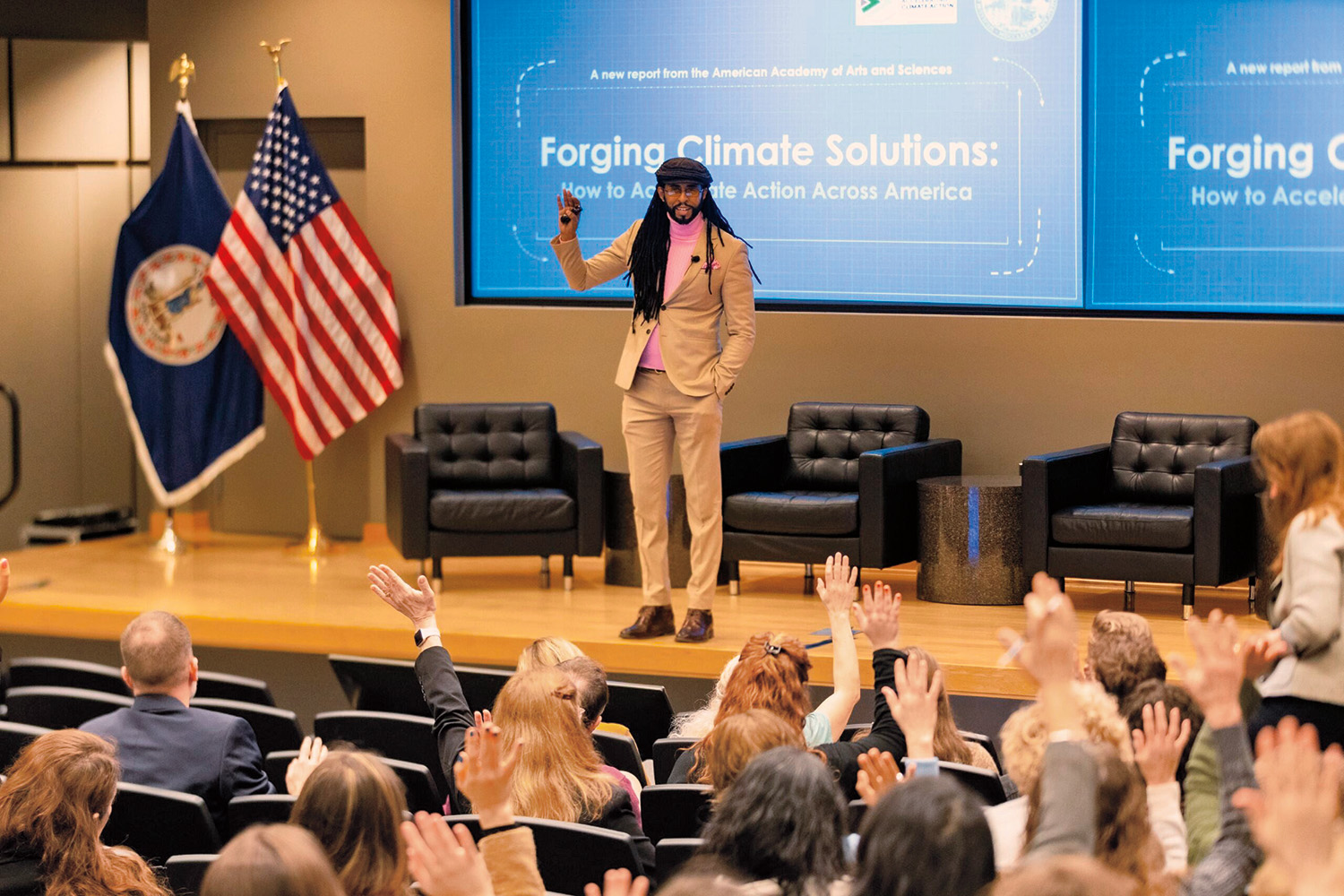 Mustafa Santiago Ali addresses a seated audience. 