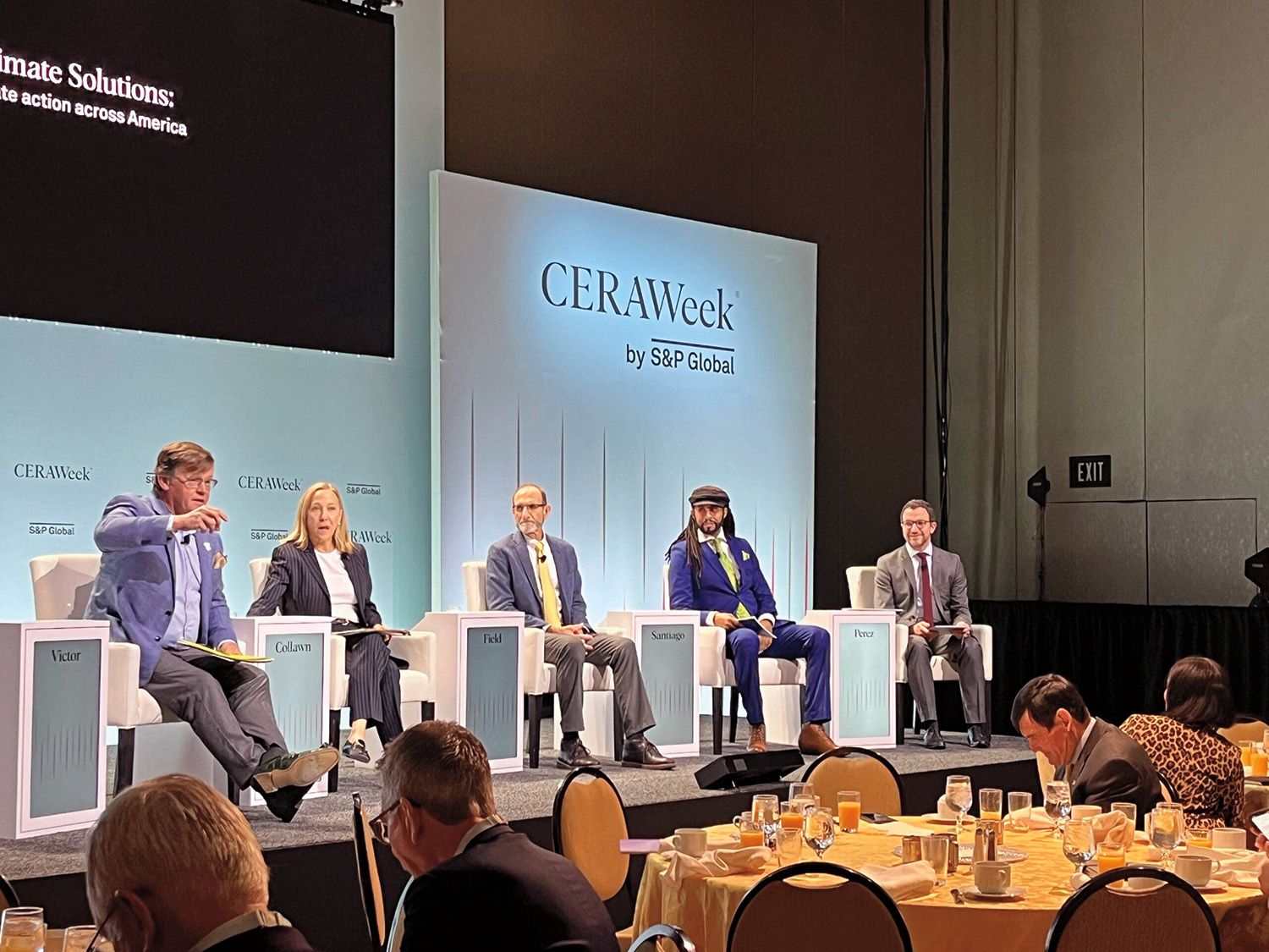 David Victor, Patricia Vincent-Collawn, Christopher Field, Mustafa Santiago Ali, and Julien Perez are seated on stage and face an audience, which is seated at round tables. The backdrop behind the panelists reads “CERAWeek by S&P Global.” 