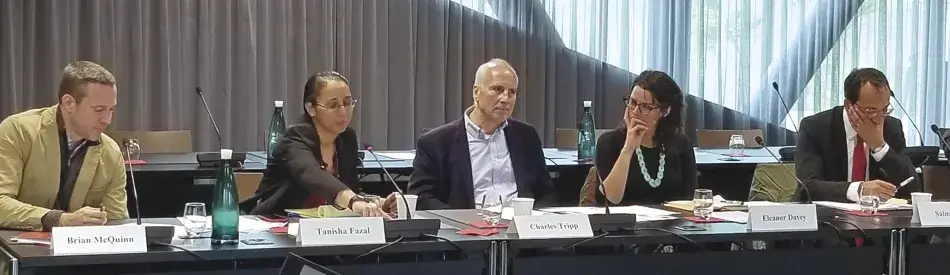 Brian McQuinn, Tanisha Fazal, Charles Tripp, Eleanor Davey, and Salman Bal participate in a panel discussion at the workshop in Geneva.  