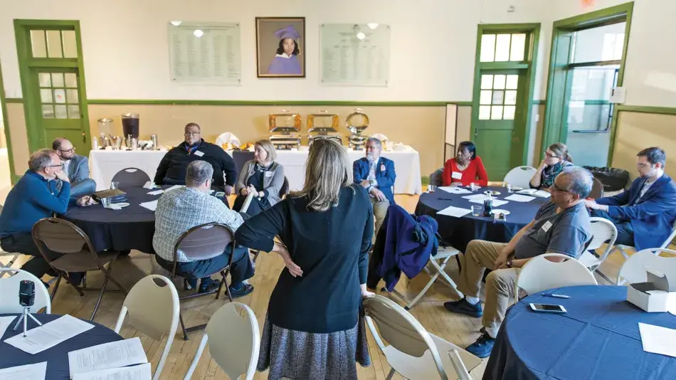 A listening session at the Moton Museum in Farmville, VA, in April 2019. Formerly R. R. Moton High School, the building is now a national historic landmark and community space, recognized for its role in the landmark Brown v. Board of Education case. In the background is a portrait of student Barbara Rose Johns, who led a student strike for equal education in 1951, when she was sixteen years old. 