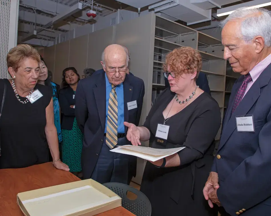 Shulamit Reinharz, Gilbert Omenn, and Jehuda Reinharz with Academy Director of Archives Michele Lavoie, photo by Martha Stewart Photography