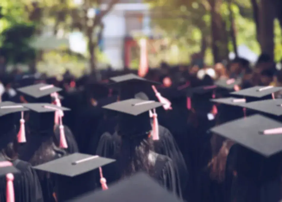 Backside of graduation hats during commencement of a university. 