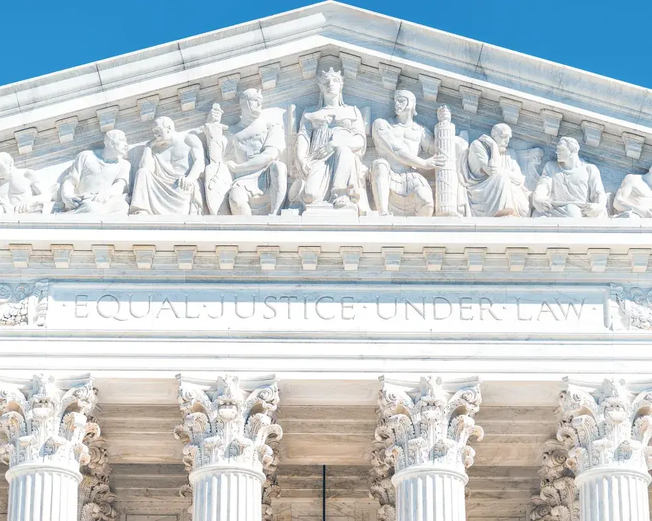 Washington DC, USA exterior of Supreme Court building marble architecture and closeup on Capital capitol hill columns pillars by entrance and sign. iStock.com/krblokhin