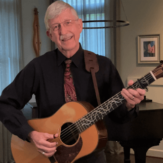 Francis S. Collins playing the guitar for the Academy's Mixtape project