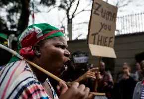 Woman protests South African president Jacob Zuma